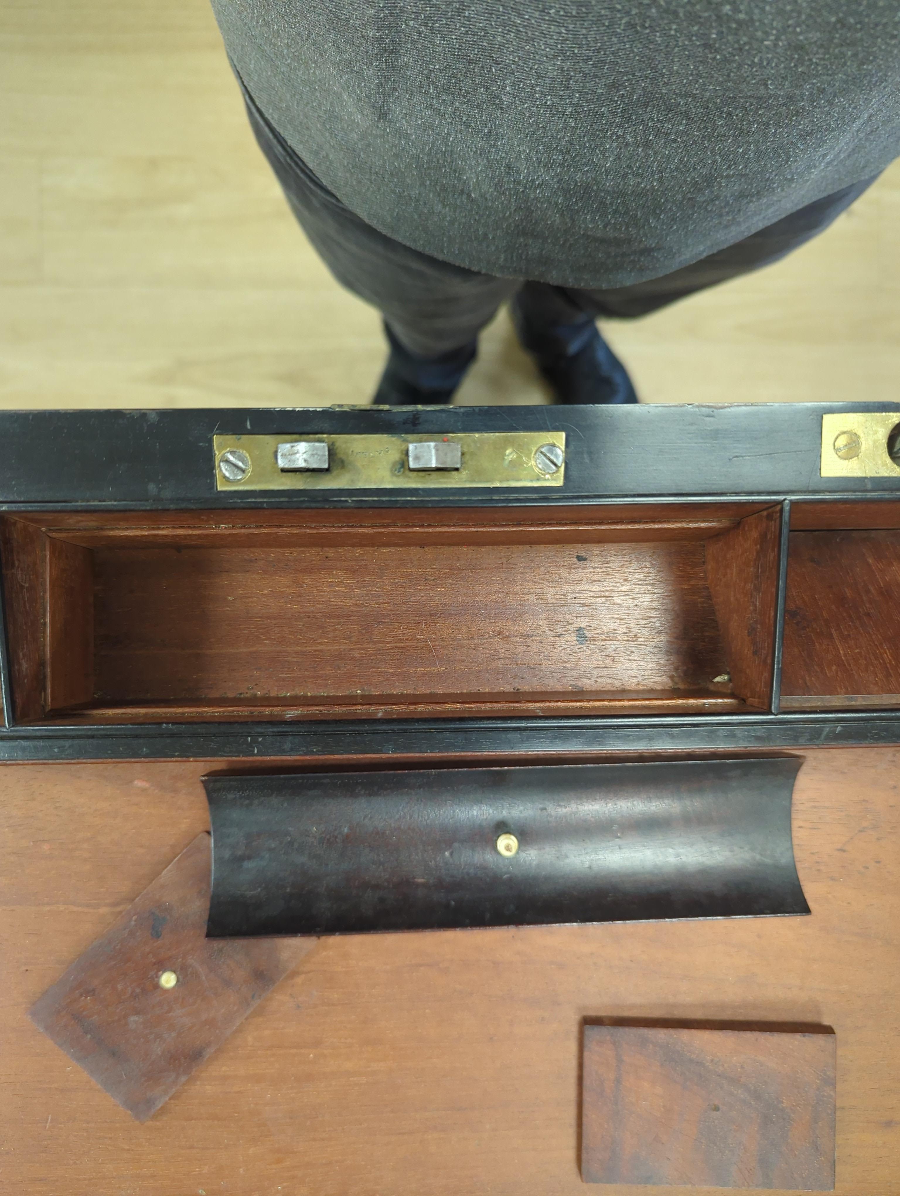 A George III mahogany, ebony and brass-mounted ship's writing box by Wells & Co., screw fixings to each side with original key, 50.5cm x 30cm x 19.5cm